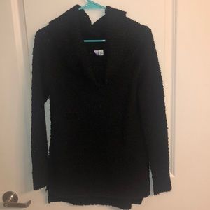 Francesca’s black turtleneck sweater